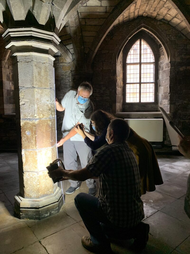 Photo of volunteers cleaning graffiti inside Greyfriars